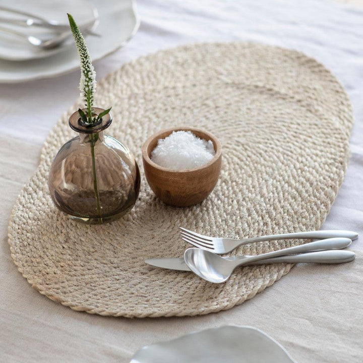 Pair of Jute table mats from Garden Trading by Cornucopia Home and Gift, showing natural woven jute texture on a table.