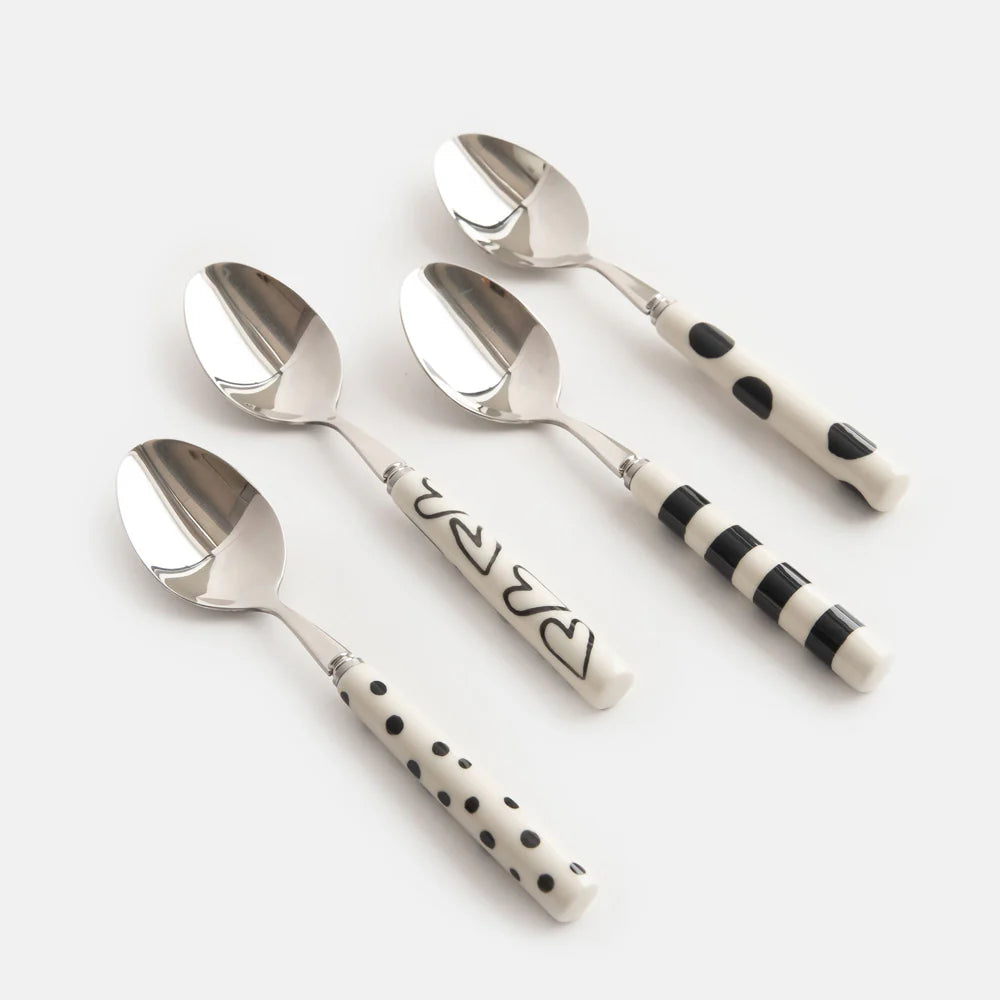 Caroline Gardner Mono Patterns boxed set of four teaspoons with colorful patterned handles, designed for gifting and everyday use.
