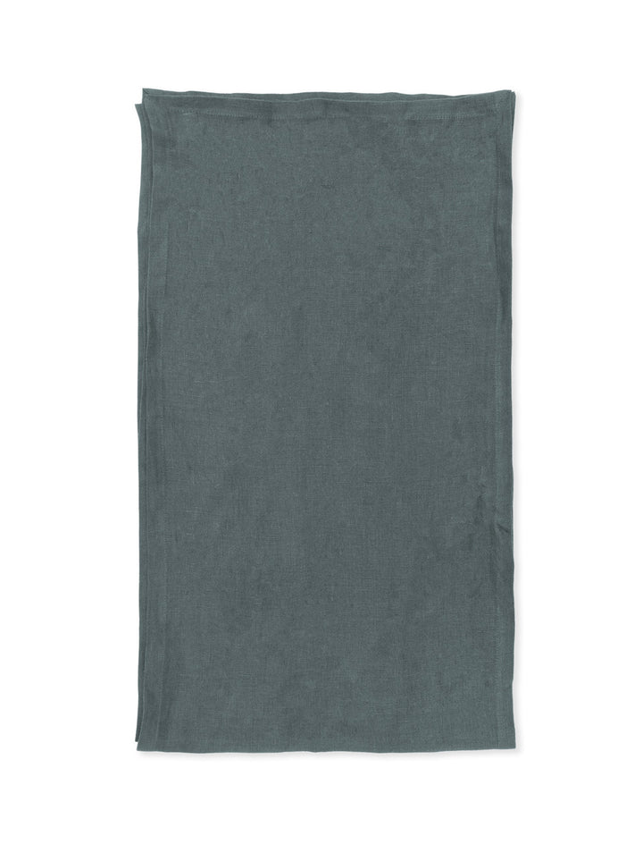 Charcoal linen table runner from Garden Trading by Cornucopia Home and Gift, shown on a dining table.