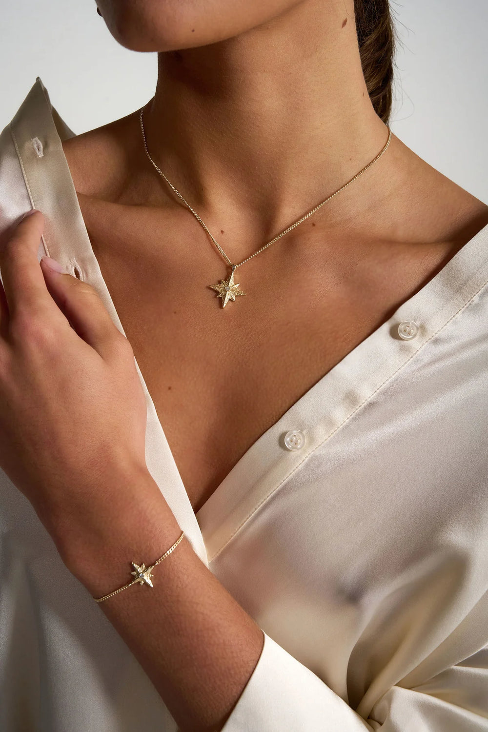 Gold Faith Necklace by Tutti & Co featuring a delicate pendant, displayed on a neutral background.