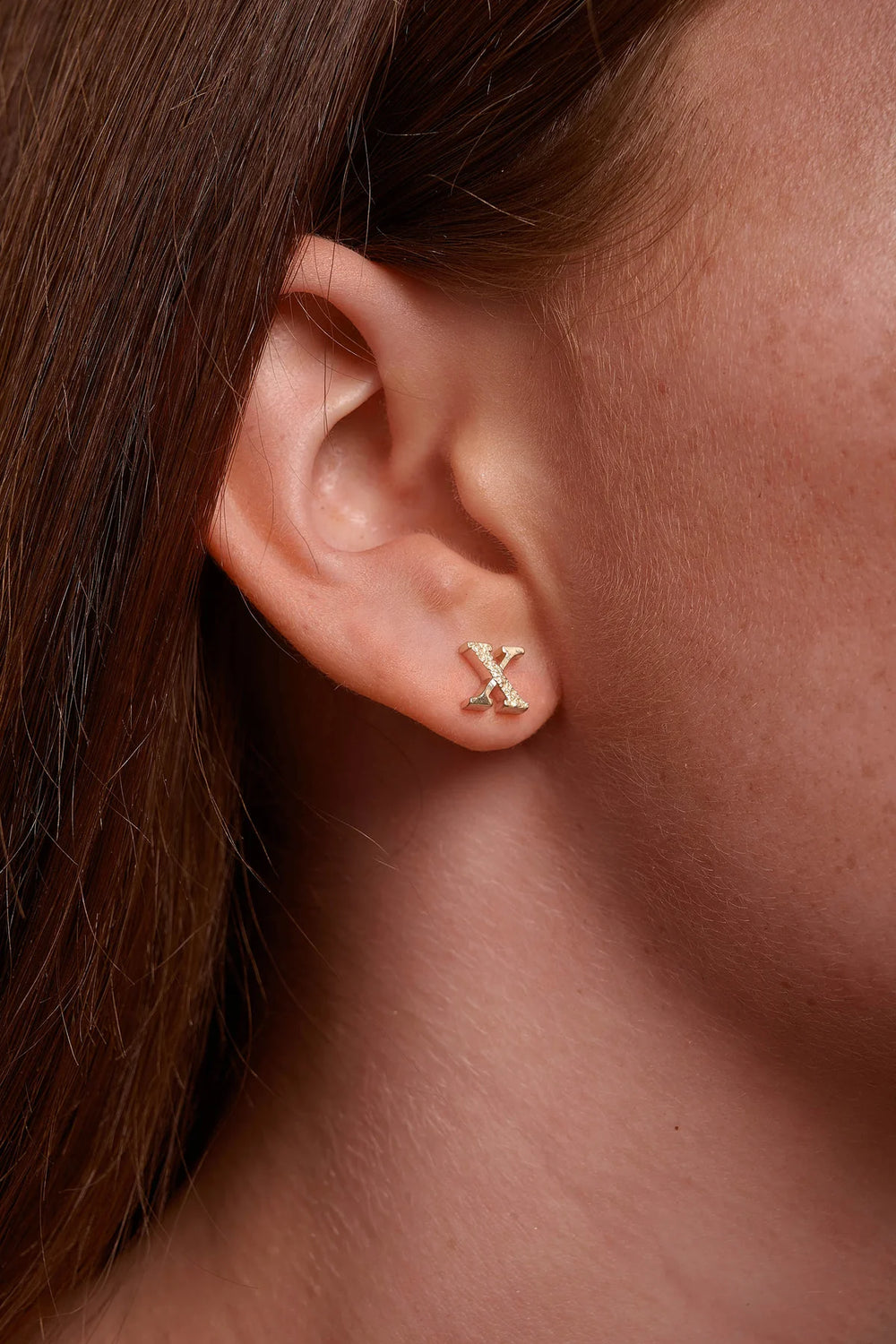 Gold Kingston earrings by Tutti & Co featuring intricate design, displayed on a neutral background.