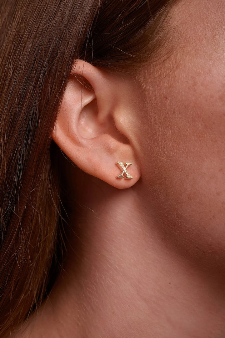 Gold Kingston earrings by Tutti &amp; Co featuring intricate design, displayed on a neutral background.