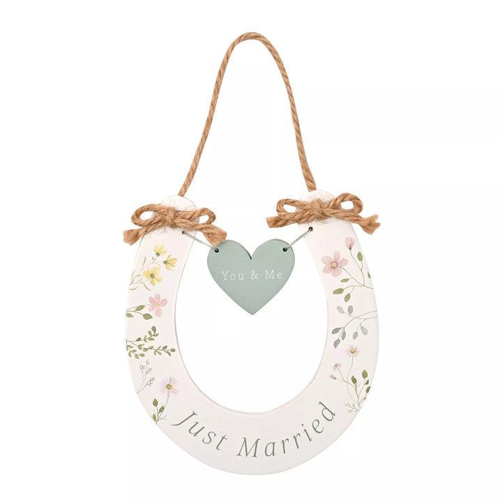 Wildflower wedding horseshoe decoration by Widdop &amp; Co, featuring delicate floral accents for special wedding celebrations.