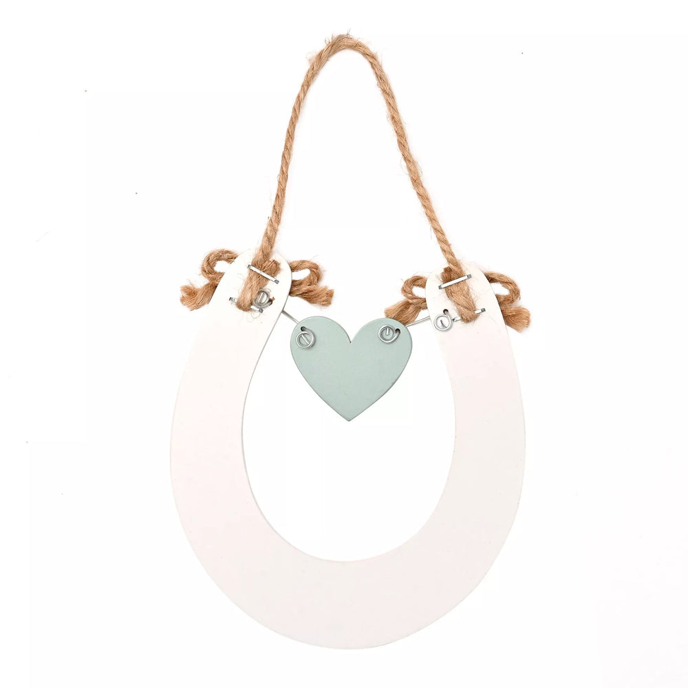 Wildflower wedding horseshoe decoration by Widdop & Co, featuring delicate floral accents for wedding decor.