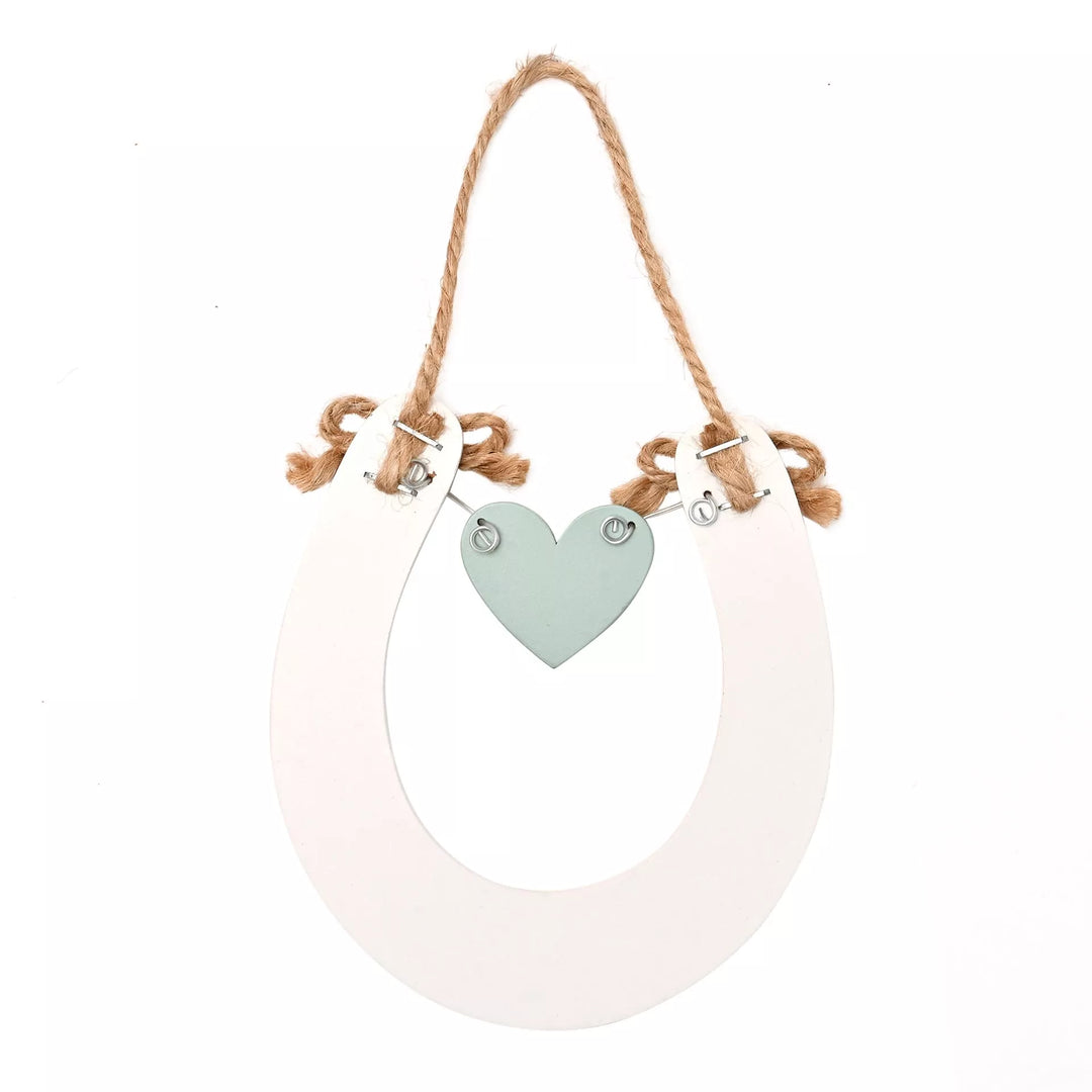 Wildflower wedding horseshoe decoration by Widdop &amp; Co, featuring delicate floral accents for wedding decor.