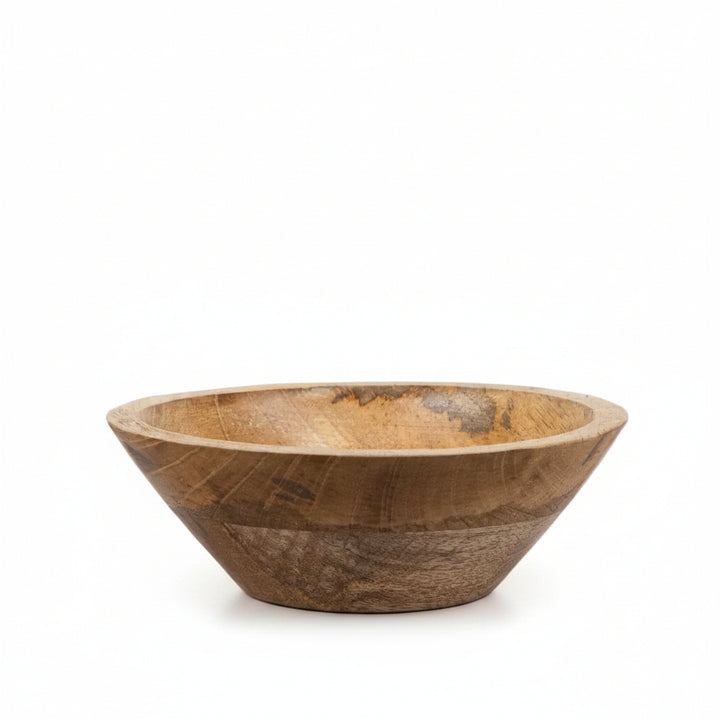 Wooden bowl on a wooden surface with a white background
