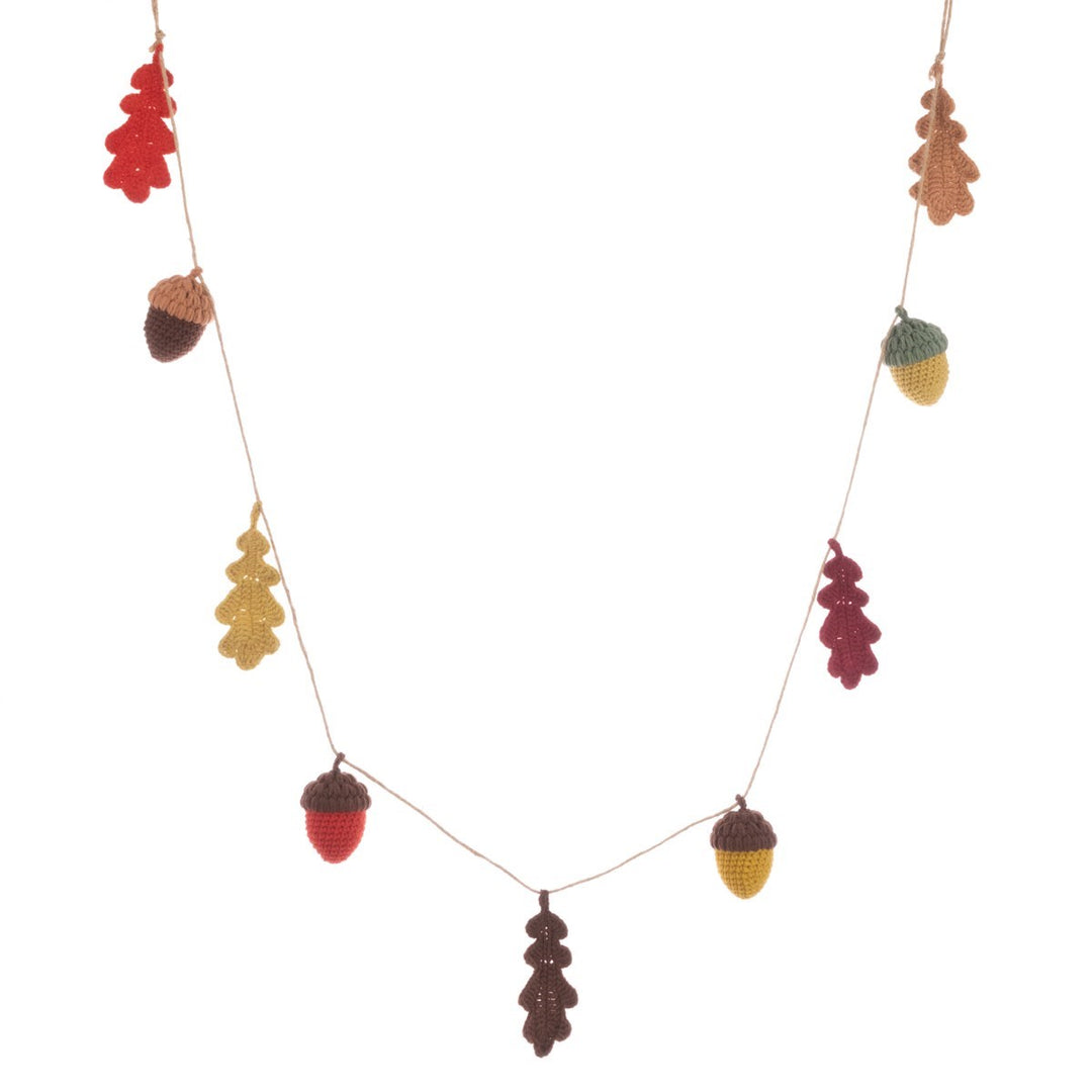 Crochet acorn and leaf garland from Floralsilk Halloween 2025 by Cornucopia Home and Gift, featuring autumn-inspired decorative elements.