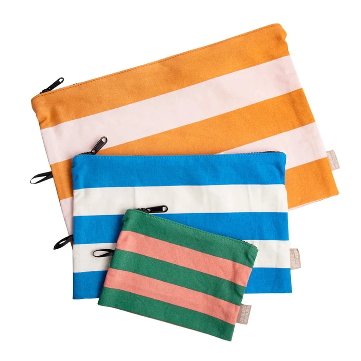 Set of three Caroline Gardner multi stripe travel pouches with colorful patterns, perfect for organizing essentials on the go.