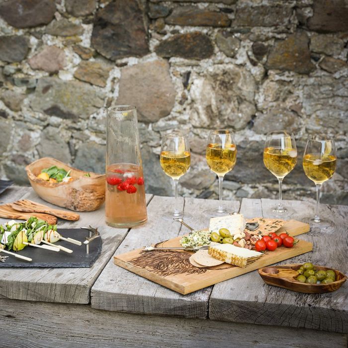 Large oak serving paddle featuring Highland cow design from Selbrae House, ideal for serving cheeses or charcuterie.