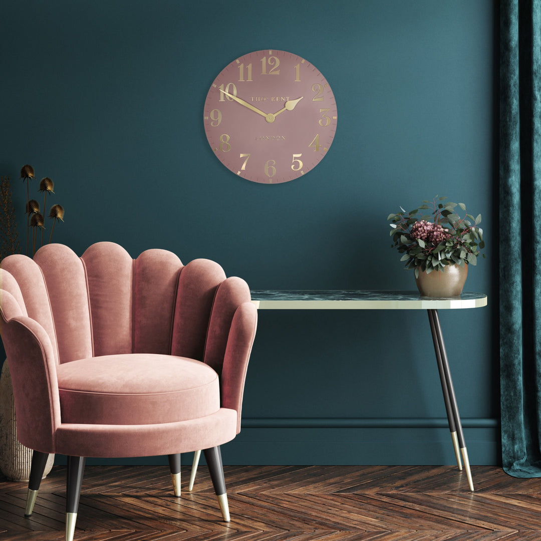 12-inch blush pink Arabic wall clock by Cornucopia Home and Gift with bold Arabic numerals and modern design.