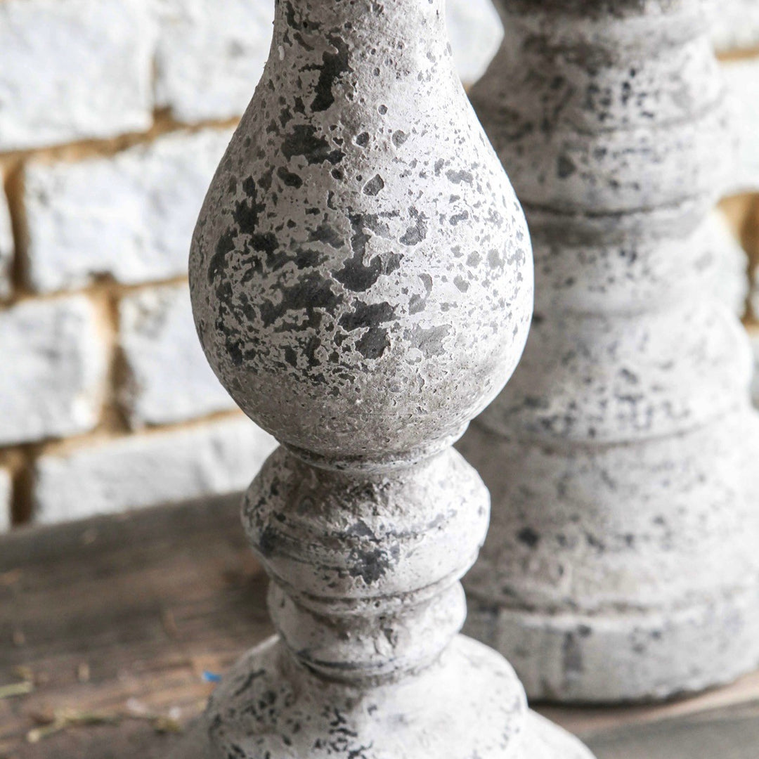 Birkdale Pillar Stone Candleholder by Cornucopia Home and Gift, featuring a textured stone design with a candle slot for decorative lighting.