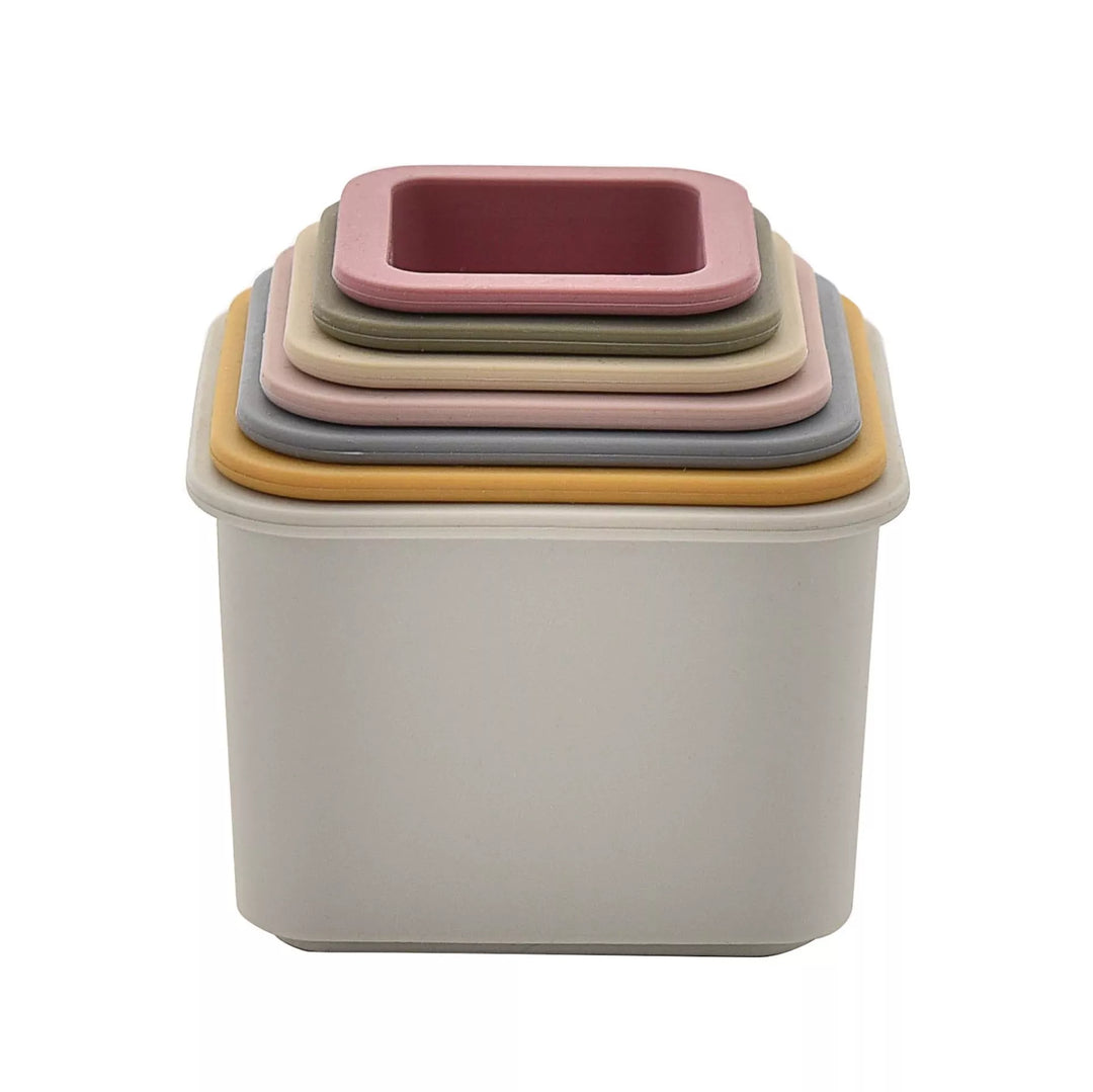 Colorful Bambino Silicone Stacking Cups by Cornucopia Home and Gift in a neat pyramid shape on a white background.