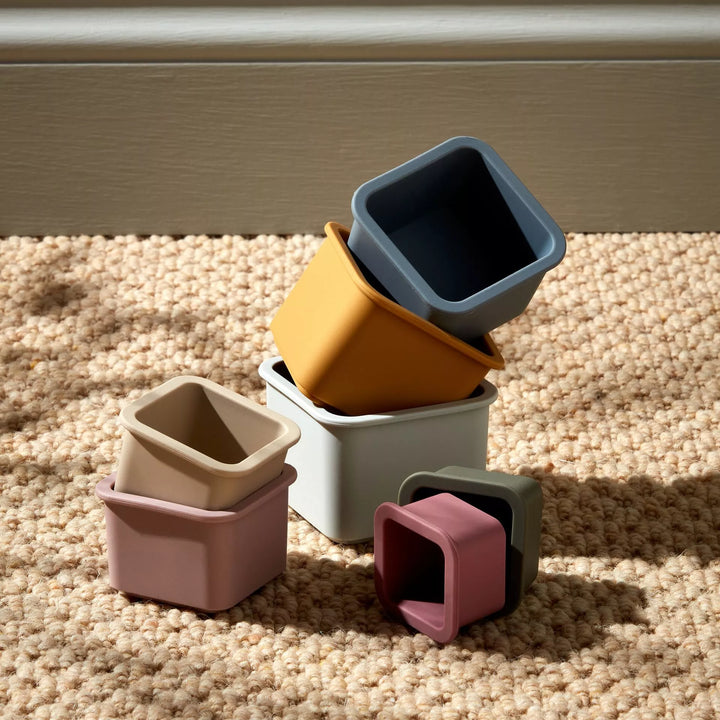 Colorful Bambino Silicone Stacking Cups by Widdop &amp; Co from Cornucopia Home and Gift, neatly stacked in vibrant shades.