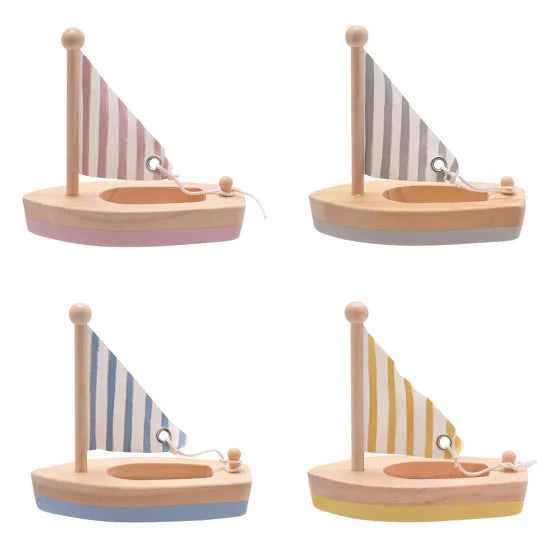 Wooden sailing boats by Bambino from Widdop &amp; Co, displayed as decorative nautical toys, crafted from light-colored wood.