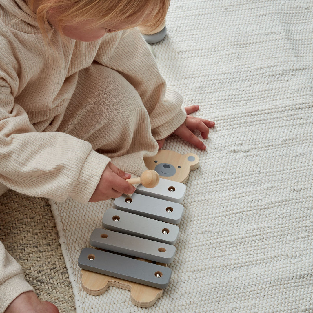 Wooden Teddy Xylophone by Widdop & Co, featuring colorful wooden bars and a teddy bear design for children's musical play.