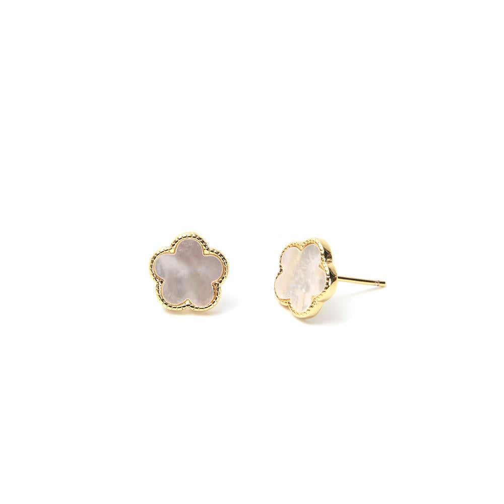 White leaf-shaped earrings with gold mother of pearl flower accents, designed as stud earrings, by Cornucopia Home and Gift.