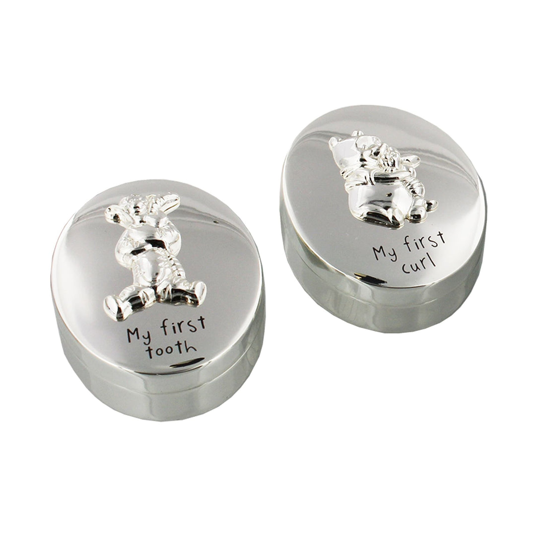 Disney Winnie the Pooh first tooth and curl set by Widdop & Co, featuring a cute Winnie the Pooh figure with space for a child's first tooth and curl.