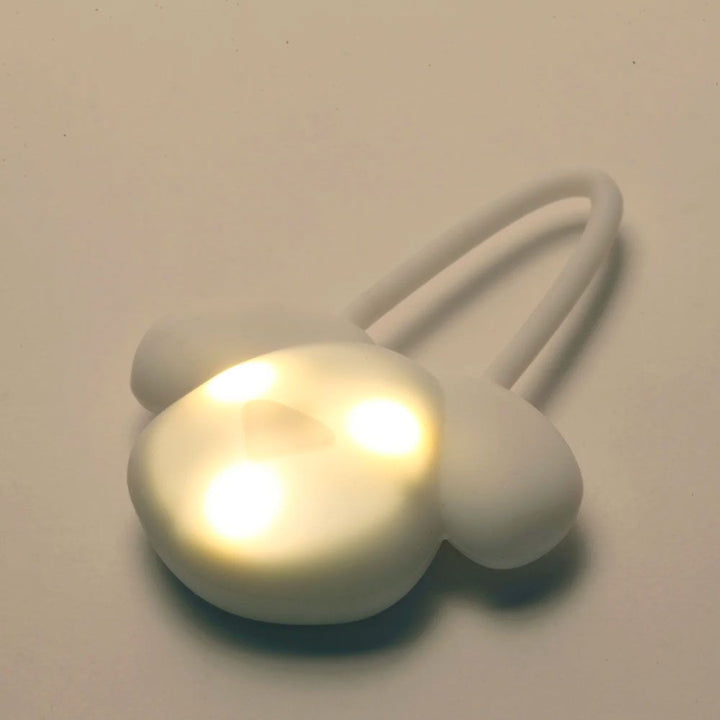 Kikkerland Light Up Name Tag with illuminated display, designed by Cornucopia Home and Gift, featuring a modern, stylish look.