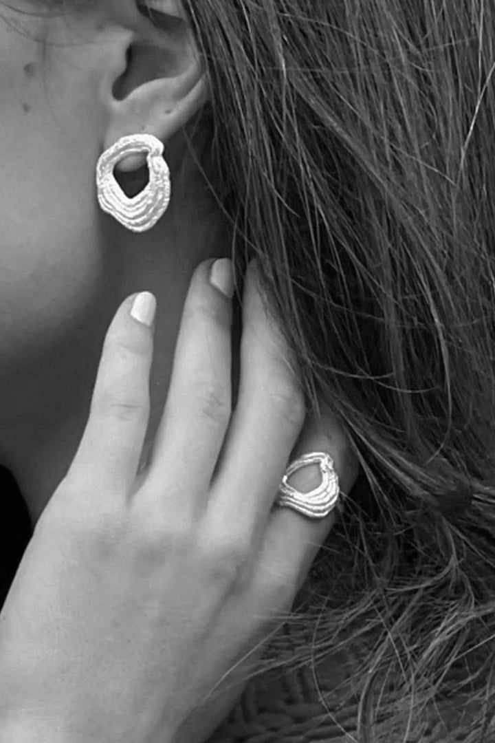 Silver Drift Ring from Tutti &amp; Co featuring a sleek, minimalist design, displayed on a neutral background.