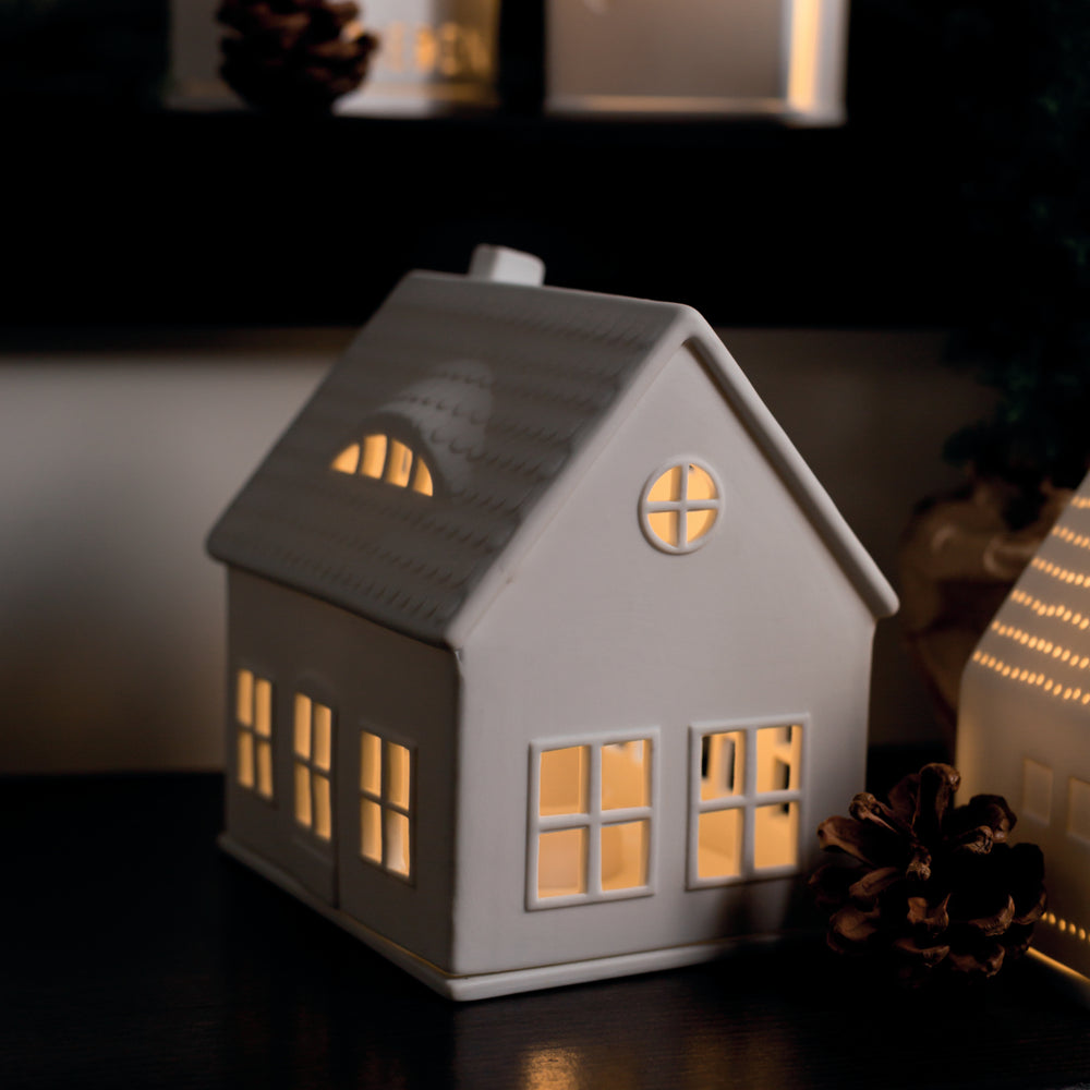 Cornucopia Home and Gift Räder Dormer Tea Light House, decorative ceramic lantern with intricate detailing and a small opening for tea lights.