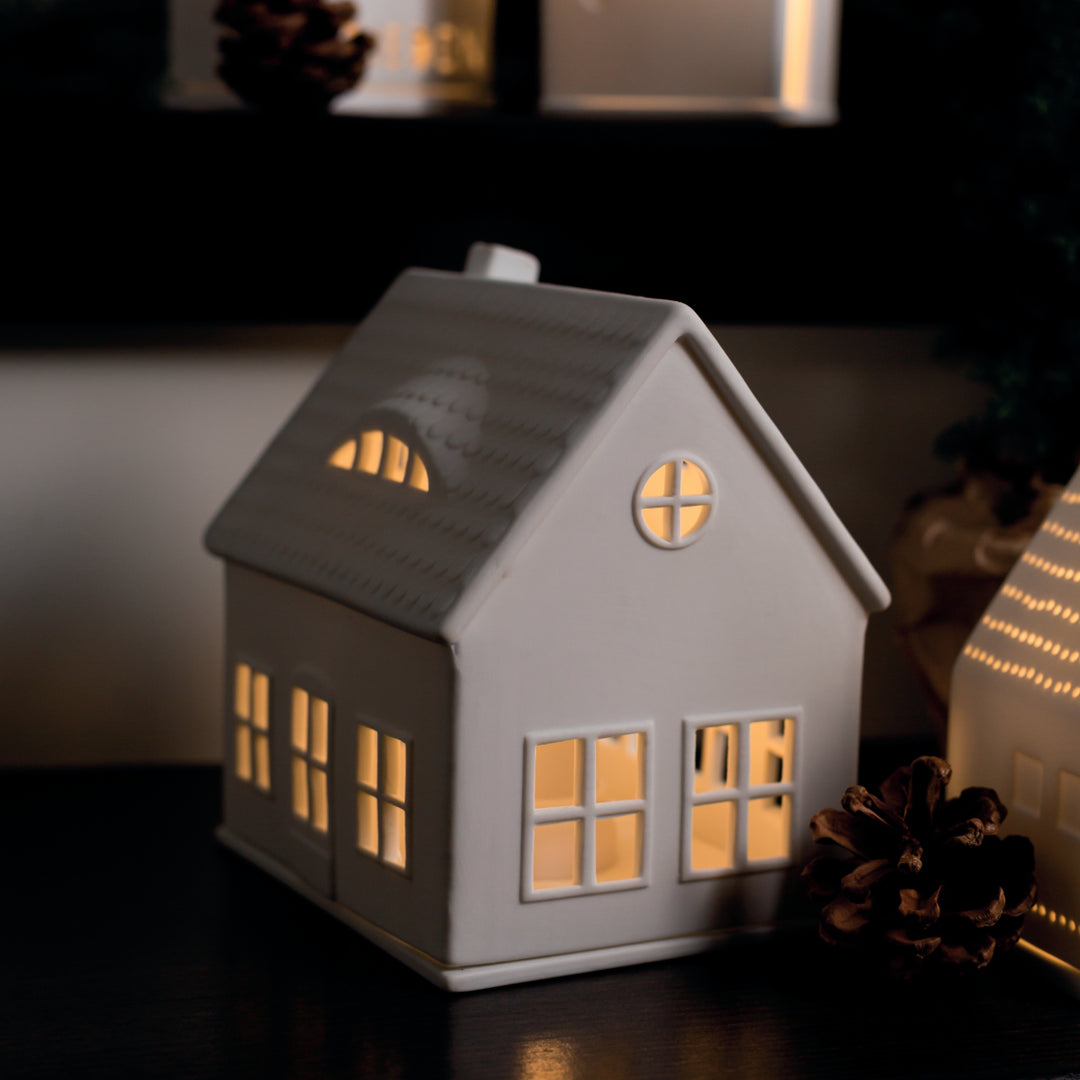 Cornucopia Home and Gift Räder Dormer Tea Light House, decorative ceramic lantern with intricate detailing and a small opening for tea lights.