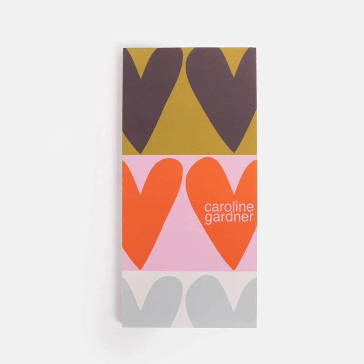 Caroline Gardner Colourblock Hearts list pad with vibrant pink, red, and white colorblocks and heart designs, perfect for notes and lists.