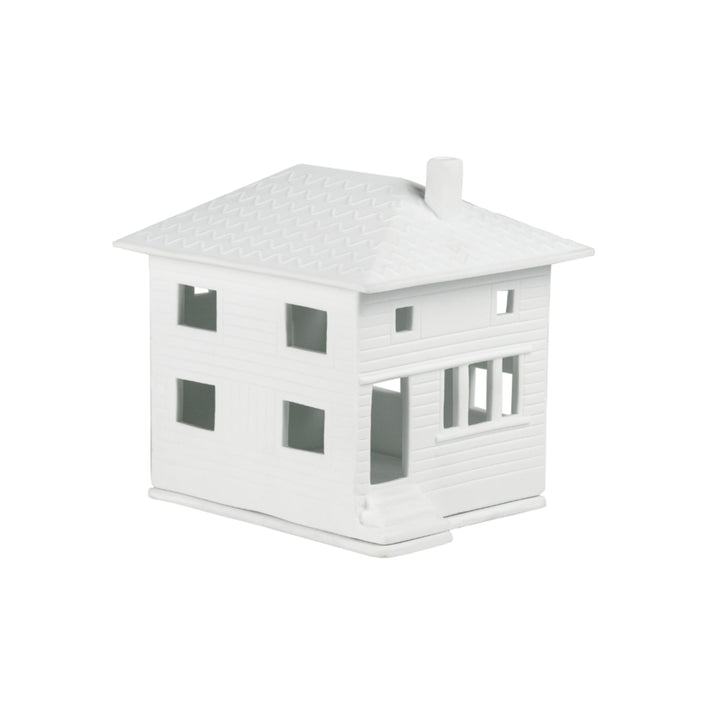 Porcelain light house figurine named Räder City Villa by Cornucopia Home and Gift, featuring intricate cityscape details.