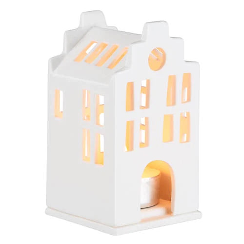 Radër Räder Small Tea Light House by Cornucopia Home and Gift with intricate cutout design and warm candle glow.