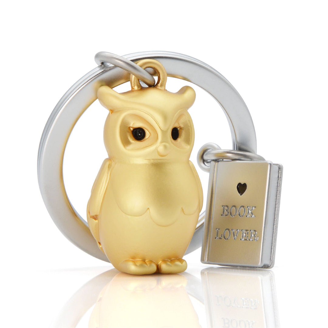 Gold owl and book keyring by Oli Olsen featuring detailed owl and book charms on a keyring.