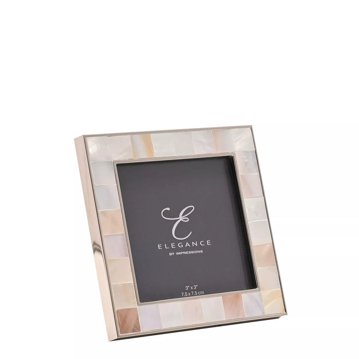 Elegant metal and mother of pearl photo frame by Widdop &amp; Co, with intricate design and a polished finish.