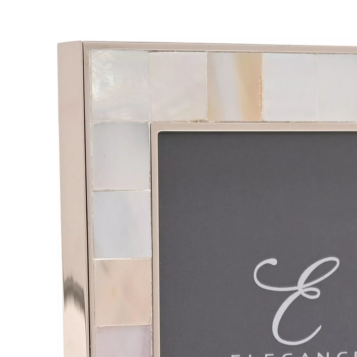 Widdop &amp; Co metal and mother of pearl photo frame with intricate design, suitable for displaying cherished photographs.