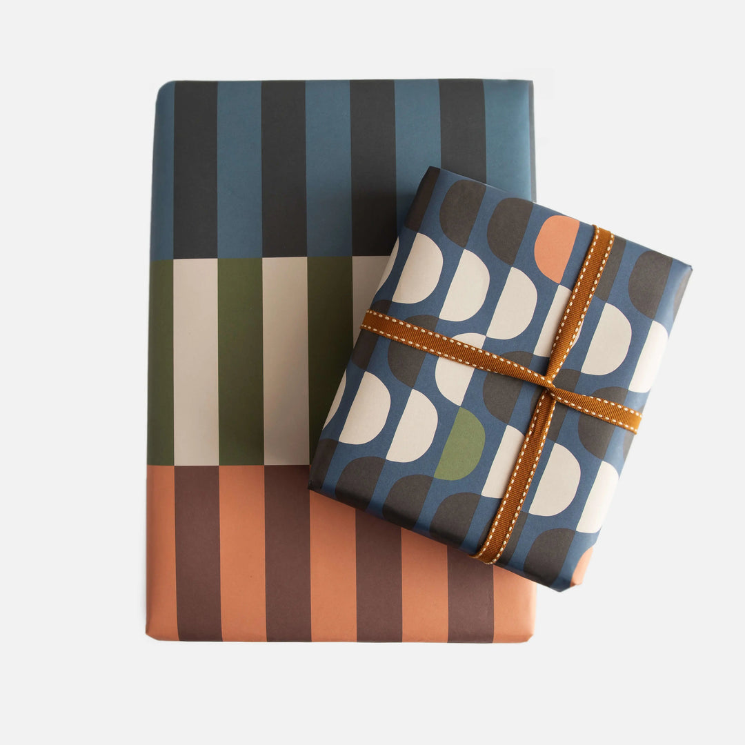 Caroline Gardner double-sided offset stripe semi-circle geometric flat wrap with vibrant colors and modern design.
