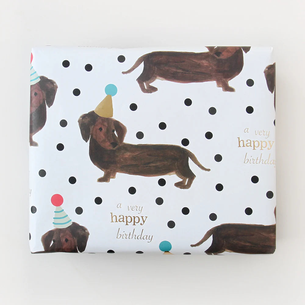 Caroline Gardner Sausage Dog foil flat wrap featuring a playful cartoon sausage dog design, ideal for gift wrapping or decorative purposes.