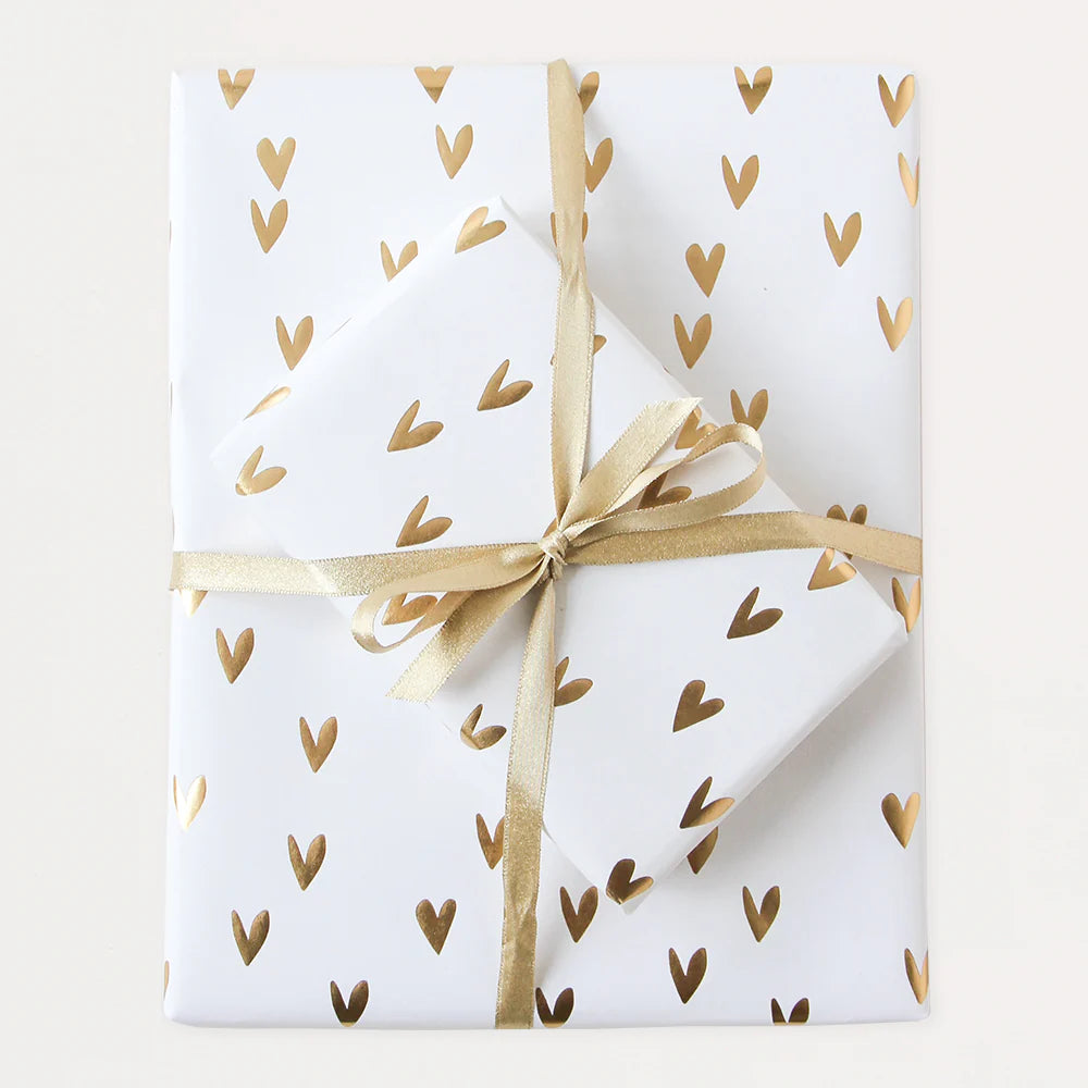 Caroline Gardner foil hearts wrapping paper featuring shiny silver hearts on a white background, ideal for gift wrapping.