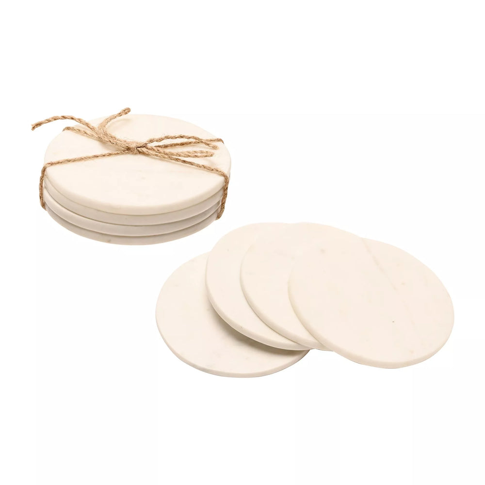 Set of 4 white marble coasters by Widdop & Co from Cornucopia Home and Gift, featuring smooth, polished surface and rounded edges.