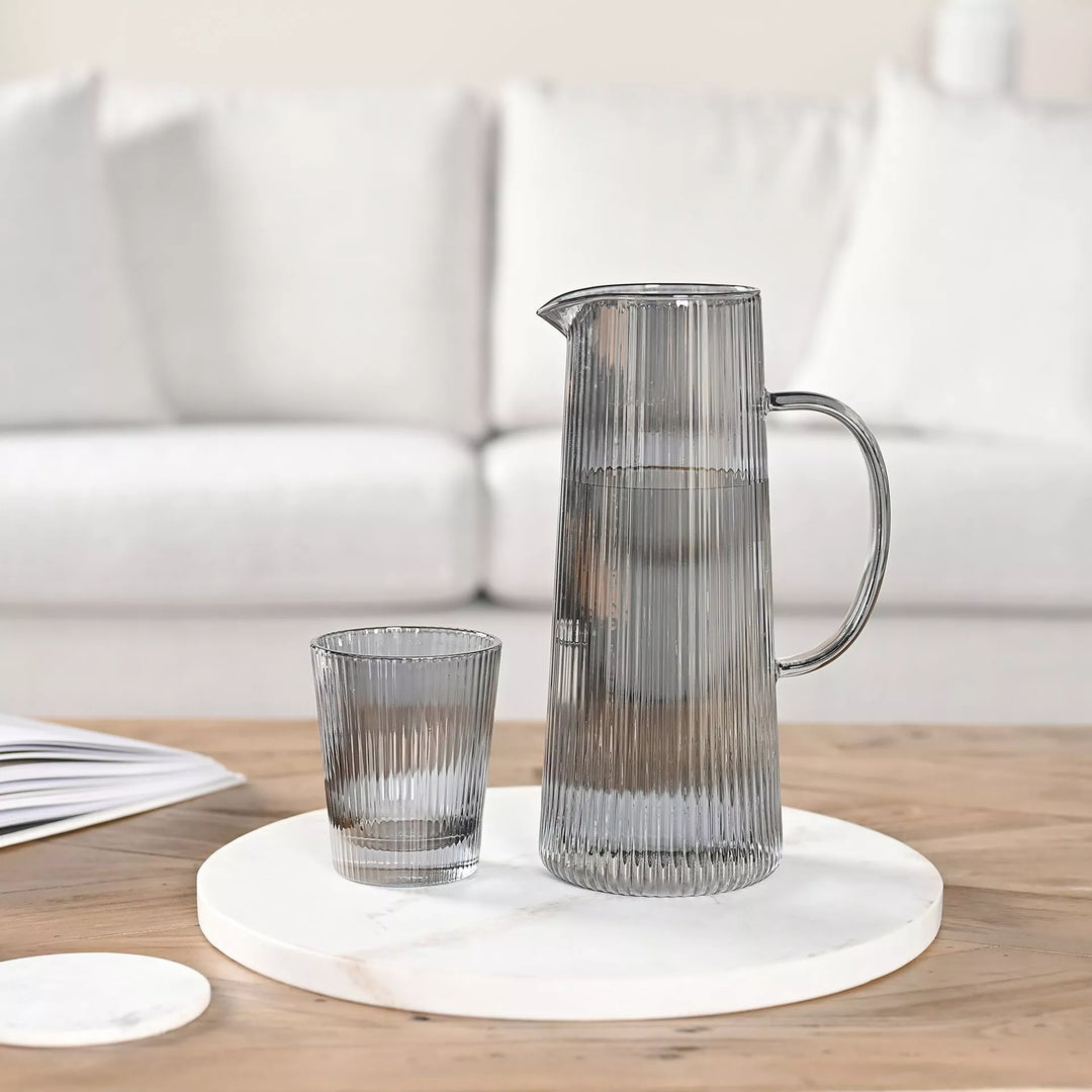 Set of 4 white marble coasters by Widdop &amp; Co from Cornucopia Home and Gift, showing smooth polished surfaces and rounded edges.