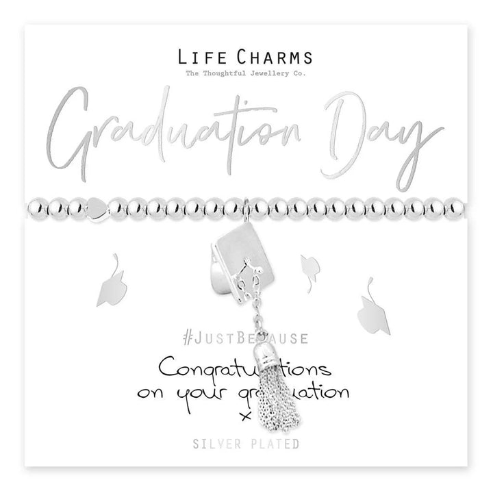 Graduation Day bracelet from Cornucopia Home and Gift featuring life charms on a delicate chain.