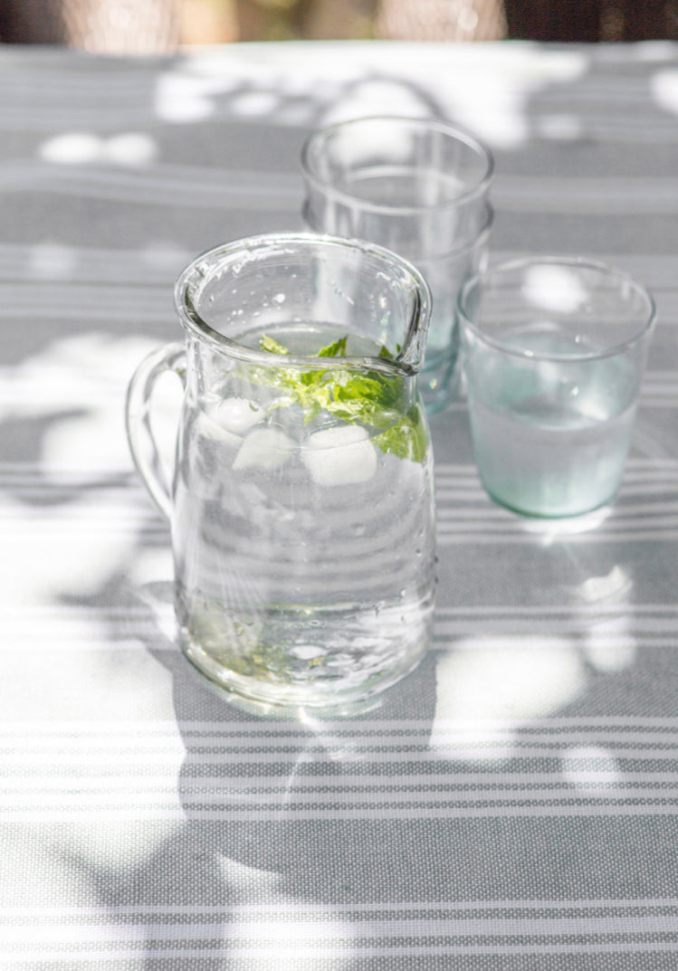 Large glass meze jug by Garden Trading, with a clear, rounded design and sturdy handle, ideal for serving beverages.