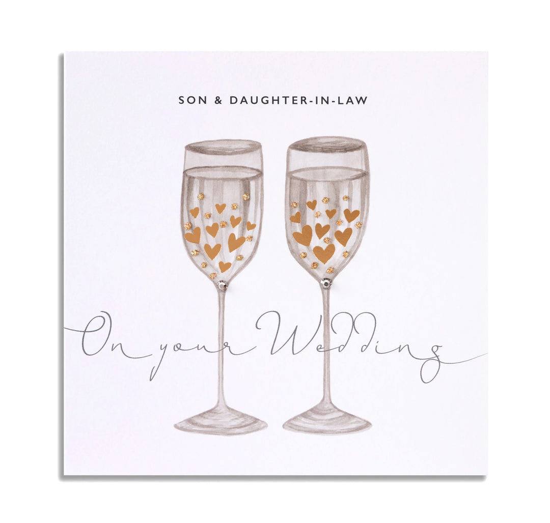 Janie Wilson wedding card featuring son and daughter-in-law illustration, by Cornucopia Home and Gift, on a white background.