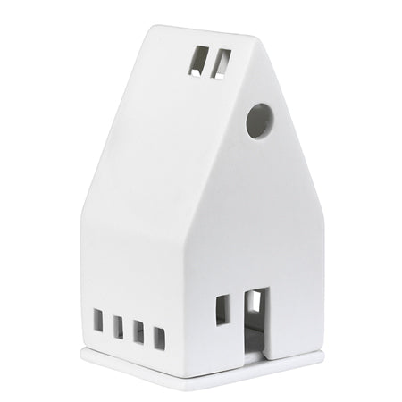 Small porcelain lighthouse by Räder, designed by Cornucopia Home and Gift, featuring a detailed white lighthouse with windows and a light top.
