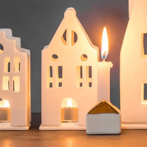 Porcelain Manor Light House Radër by Cornucopia Home and Gift, detailed porcelain lighthouse with intricate design and delicate features.