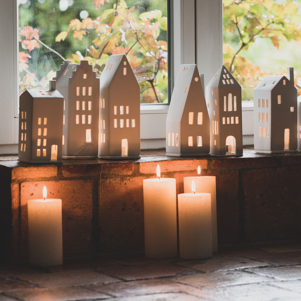 Radër Light House Tower by Cornucopia Home and Gift, featuring a detailed miniature lighthouse with a textured base and intricate design.
