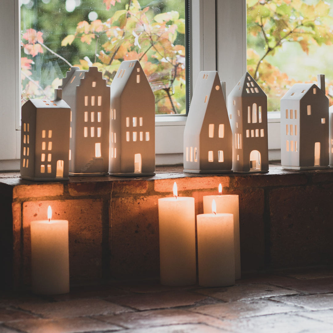 Radër Light House Tower by Cornucopia Home and Gift, featuring a detailed miniature lighthouse with a textured base and intricate design.