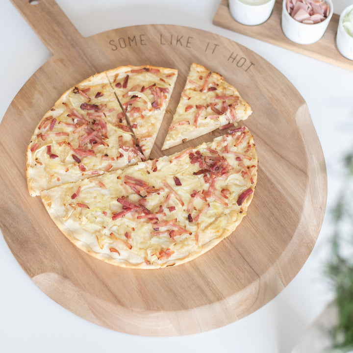 Radër acacia wood pizza and tart serving tray by Cornucopia Home and Gift, featuring a rectangular design with raised edges.
