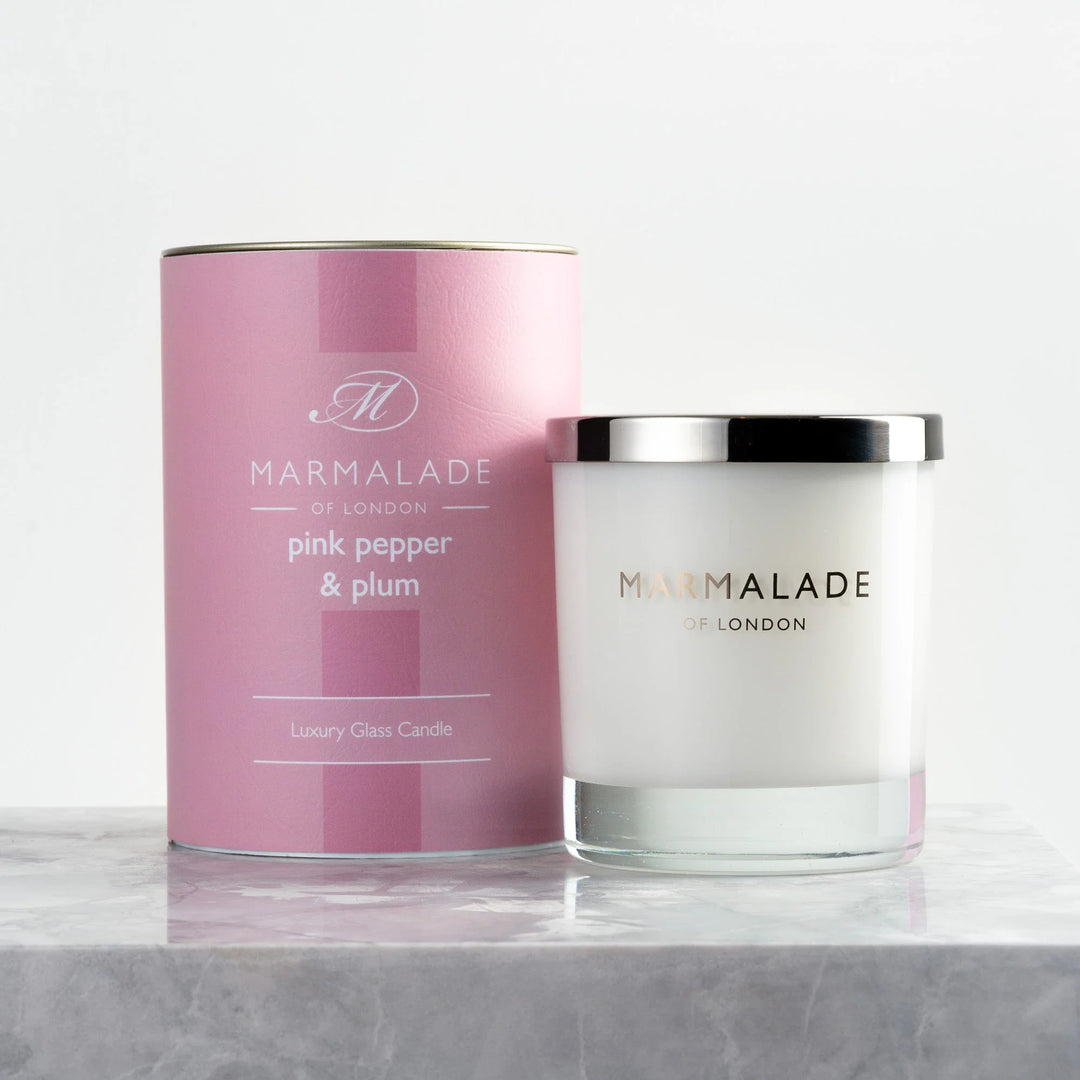 Pepper & Plum Glass Candle by Cornucopia Home and Gift, Marmalade Candles, in a clear glass holder with a warm, inviting glow