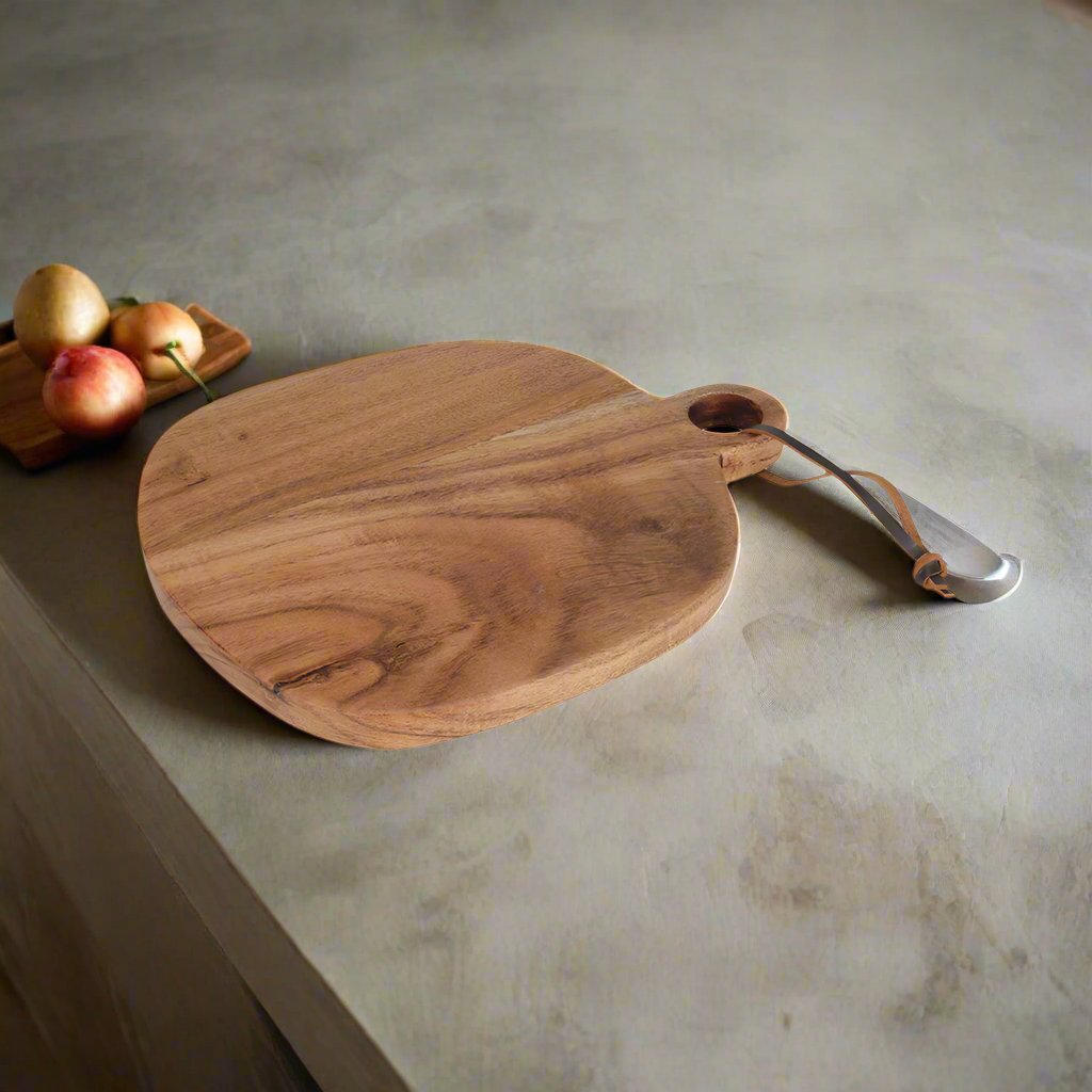 Medium acacia chopping board by Cornucopia Home and Gift, featuring a smooth wooden surface perfect for food prep.