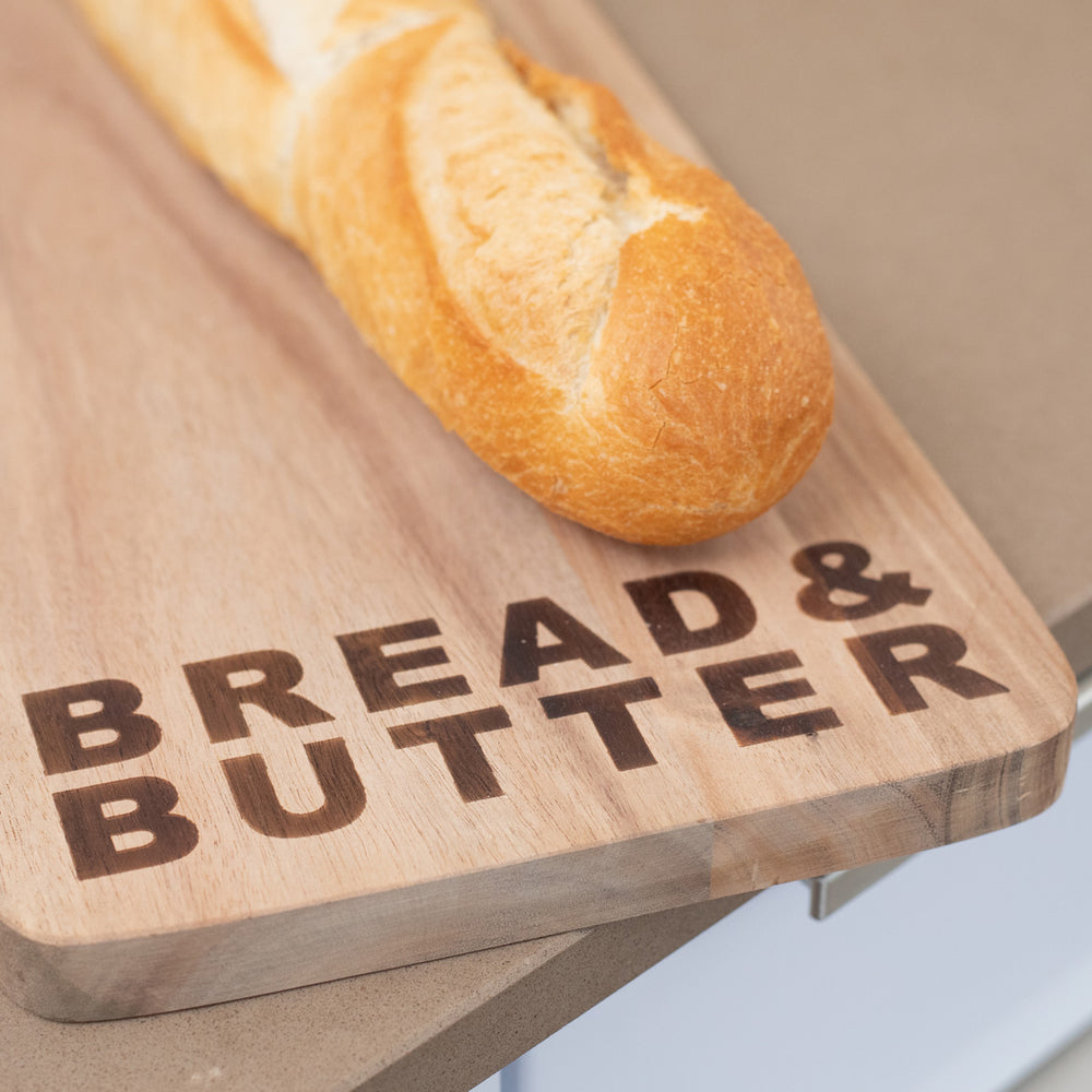 Radër wooden bread and butter board by Cornucopia Home and Gift with a natural wood finish, perfect for serving cheese and bread