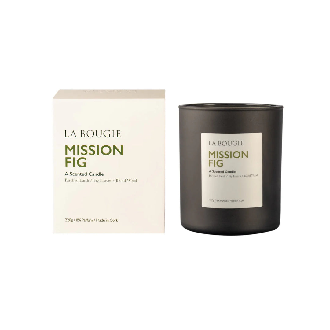 Cornucopia Home and Gift Mission Fig La Bougie candle with a lit wick and decorative container, showcasing the elegant design.