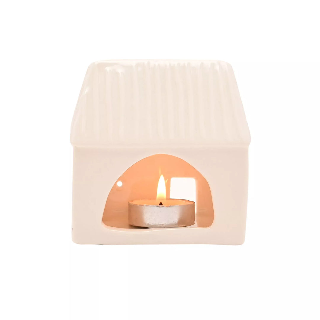 Ceramic house-shaped tea light holder by Widdop &amp; Co from Cornucopia Home and Gift, featuring a detailed house design for decorative lighting.