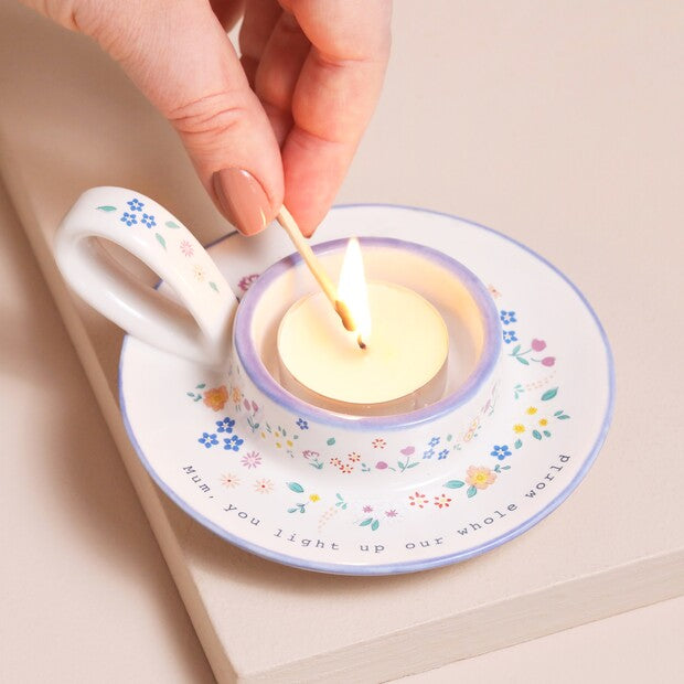 Lisa Angel Mum tealight holder with carved "You Light Up Our World" message, designed for decorative candle display.